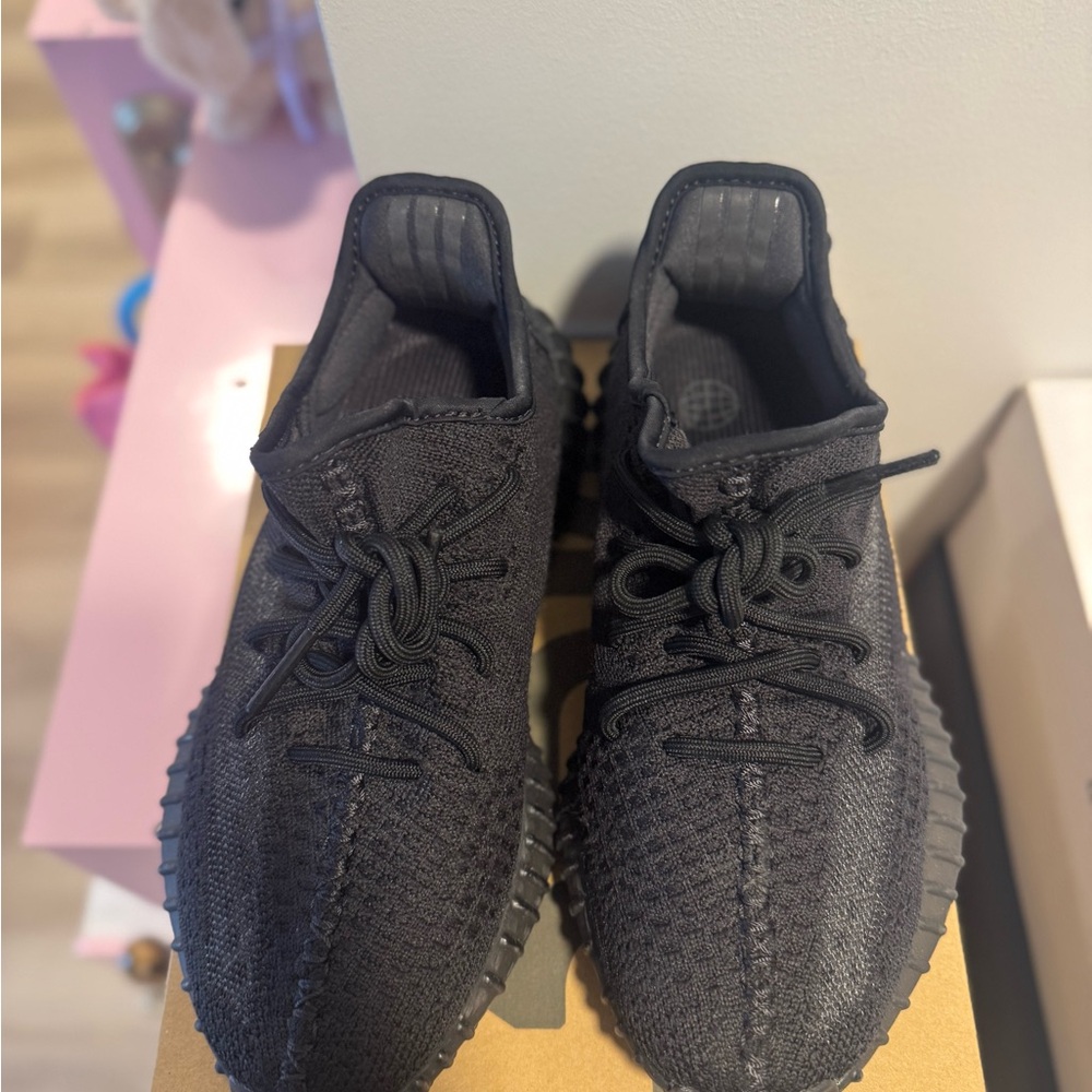 Yeezy Black Sneakers with Boost Cushioning and Knit Upper